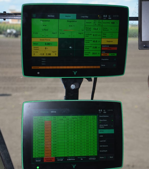 2 10-inch Precision Planting 20/20 Generation 3 display screens paired in cab