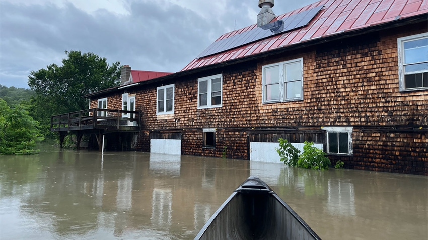 A building surrounded by brown water