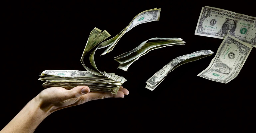 US Paper Money Flying out of Man's Hand US Paper Money Flying out of Man's Hand