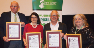 John Dreyer, Nancy Trivette, Ray Samulis and Joy Ricker, accepting for Douglas Ricker, honored for service to agriculture