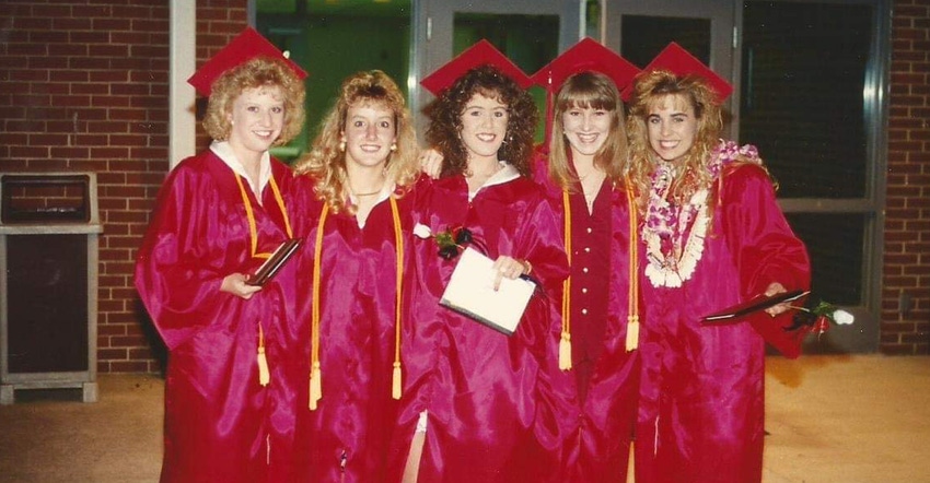 closeup behind a female college graduate wearing cap and gown