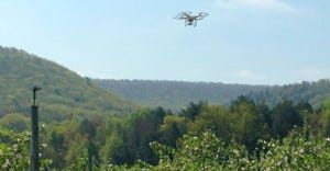 A drone flies over Penn State’s Rock Springs experimental orchard