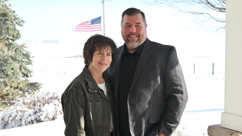 Denise and Todd Wiley in pig barn Denise and Todd Wiley in pig barn