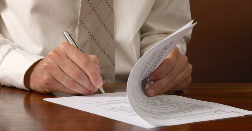 Man signing contract Man signing contract