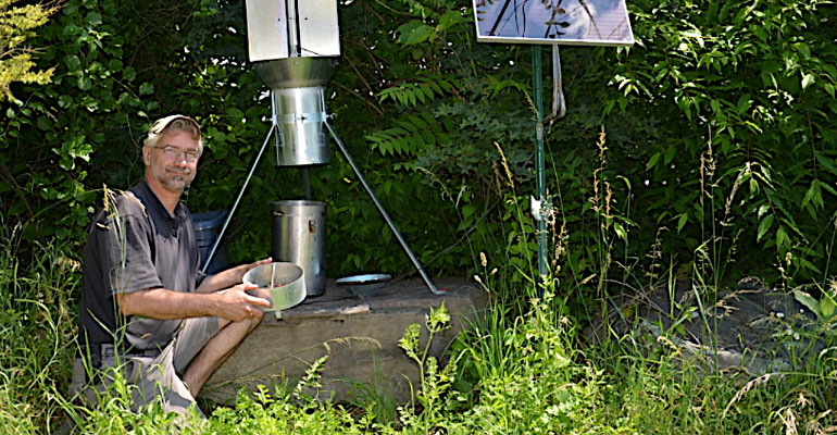 Peter Jentsch monitors brown marmorated stink bugs using a black light trap at the Hudson Valley Research Laboratory