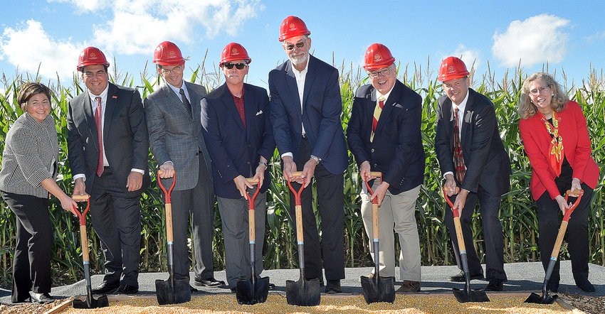 officials breaking ground for a feed mill