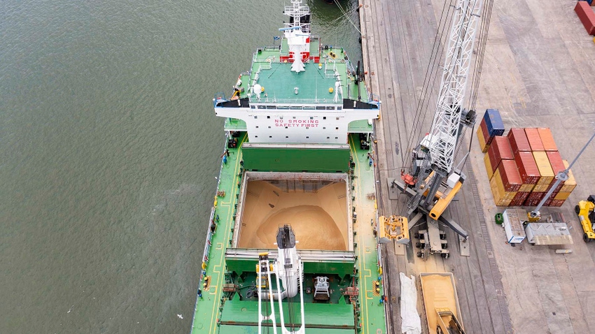 Top view of a large cargo ship loading or loading grain