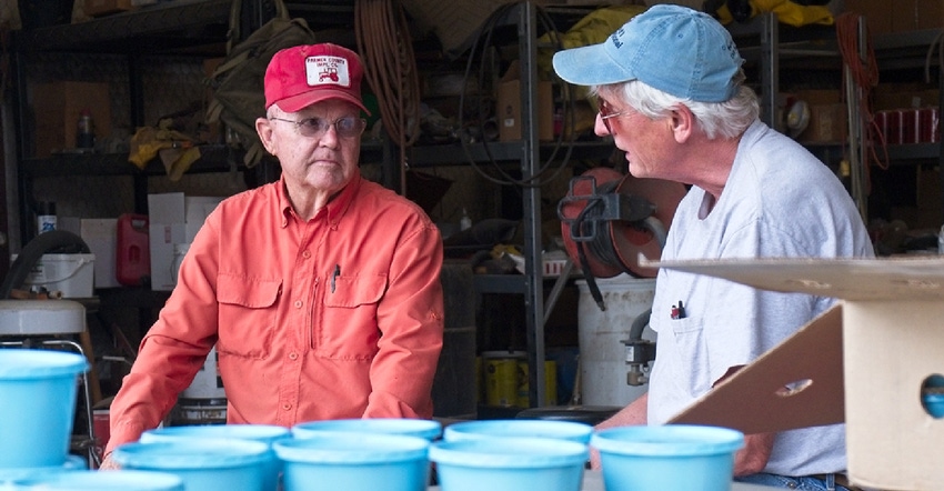 Cornell University entomologist Elson Shields talks with Texas farmer Gary Frost 