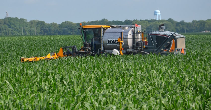 Hagie sprayer applying nitrogen to corn