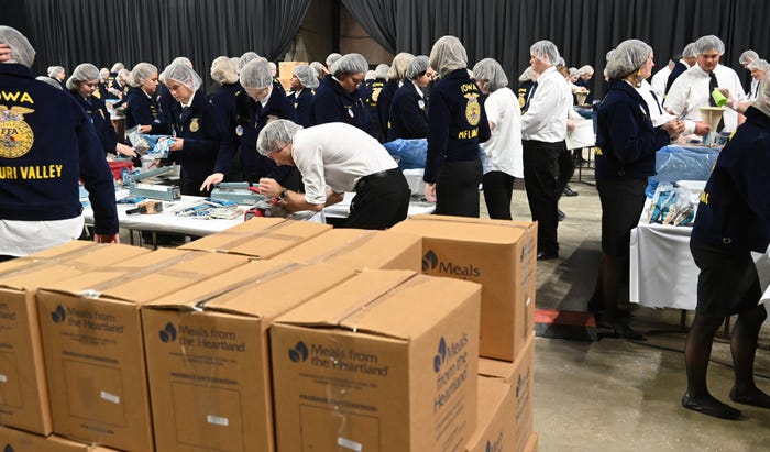 People packaging meals