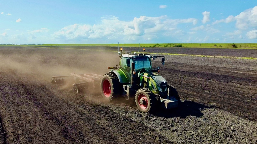 An autonomous tractor working in a field