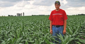 Matthew Ludtke stands in cornfield
