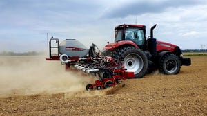 A Case IH 2130 planter working on a field