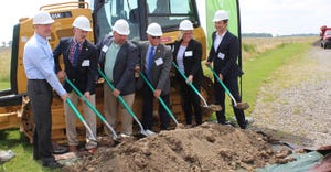 company reps and local officials break ground on wind farm