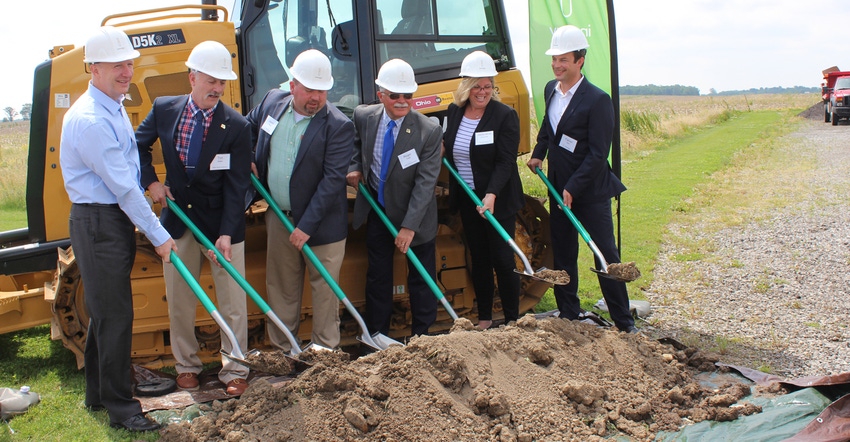company reps and local officials break ground on wind farm