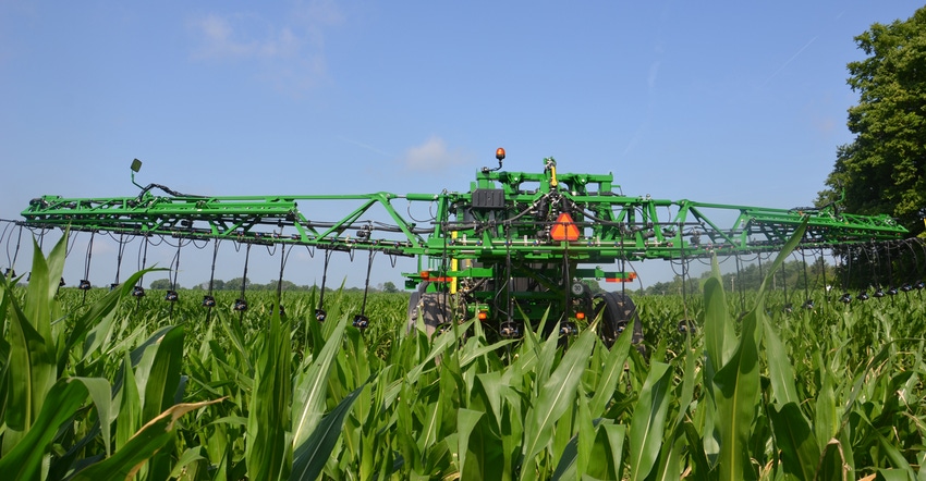 sprayer in cornfield