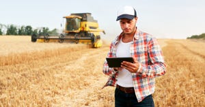 farmer holding tablet 