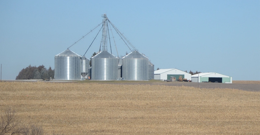 grain bins on farmland