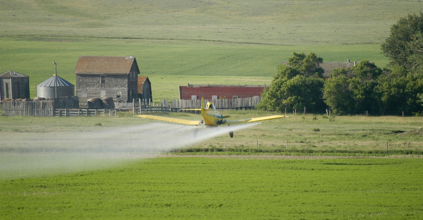 Aerial application over a field Aerial application over a field