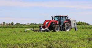 A weed zapper tractor in a soybean field