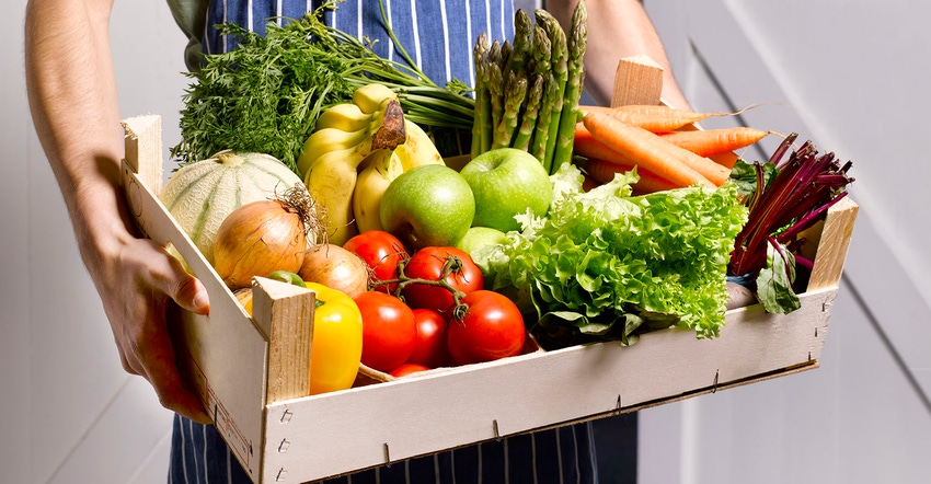 Man delivering fruit and vegetable box. Man delivering fruit and vegetable box.