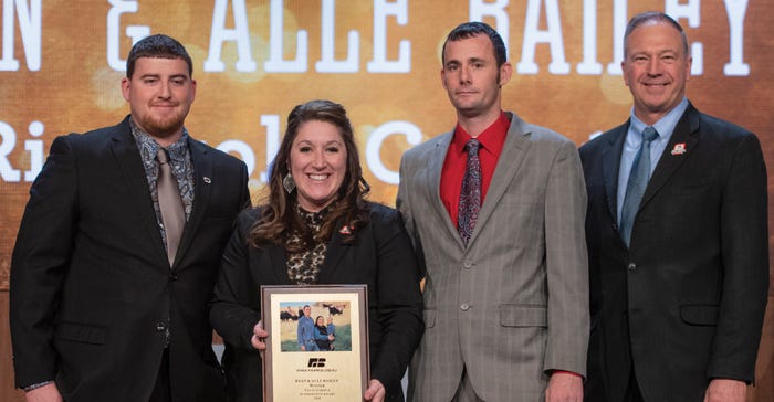 Alle and Ryan Bailey (center) won first place in the 2018 IFBF Young Farmer Leadership contest. Committee chair Michael Jacks
