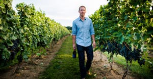 Mike Beneduce walking in vineyard