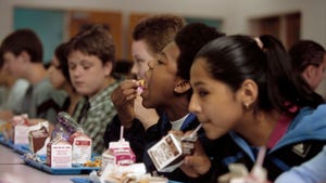 Students eating lunch in a school cafeteria