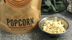 bowl of popcorn sitting next to Tristan's Kettle Corn Popcorn bag