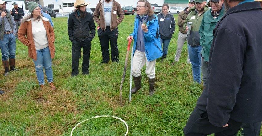 Sue Ellen Johnson of TeamAg explaining how to use a hula hoop to do a pasture evaluation Sue Ellen Johnson of TeamAg explaining how to use a hula hoop to do a pasture evaluation