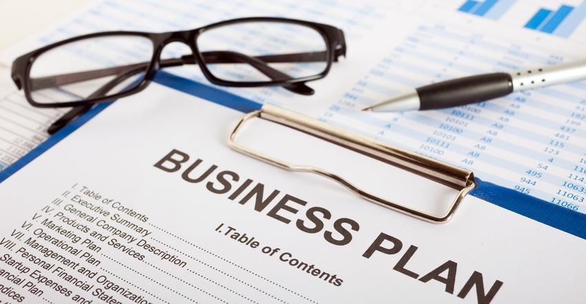 Close up of a business plan, glasses, pen and paperwork