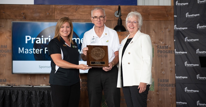 Holly Spangler presents Ted and Janet Mottaz the Master Farmer award Holly Spangler presents Ted and Janet Mottaz the Master Farmer award