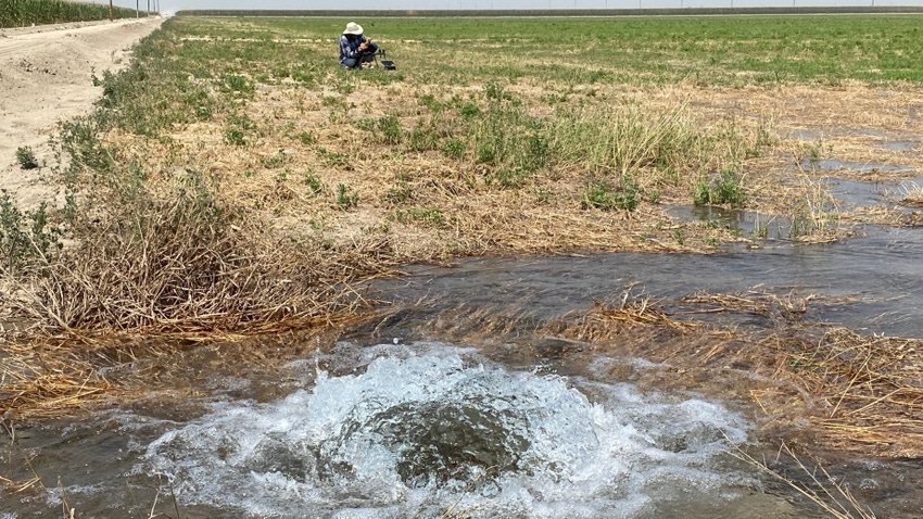 A rancher measures water diversions