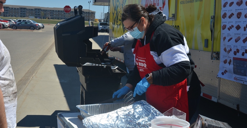 Nicole Warder of the N.D. Beef Commission serves samples of tri-tip roast during a Beef Month promotion 