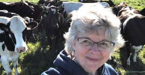 Paula Mohr taking selfie with herd of cattle