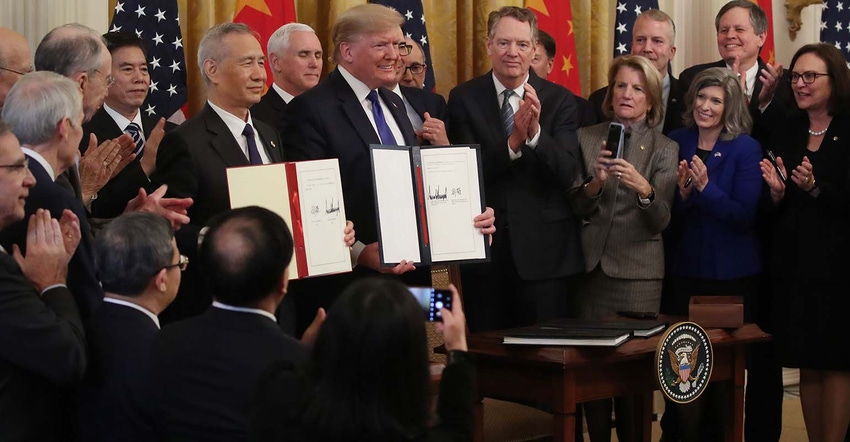 President Donald Trump and Chinese Vice Premier Liu He, hold up signed agreements of phase 1 of a trade deal between the U.S.