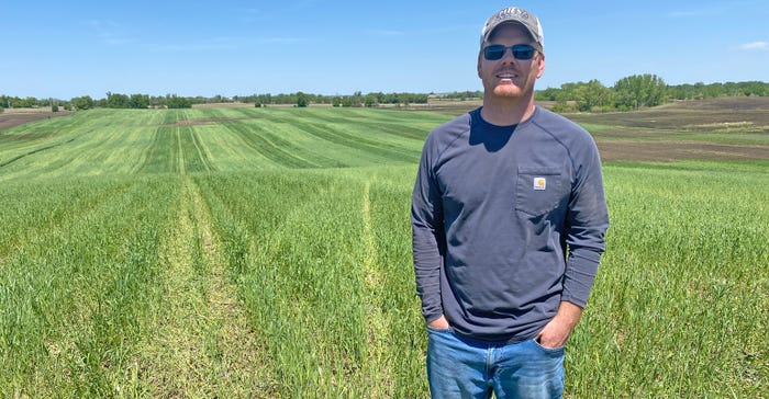 Jonathan Slinden on a hilly 40-acre parcel where he planted soybeans into cover crops 