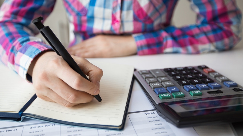 Farmer checking his finances Farmer checking his finances