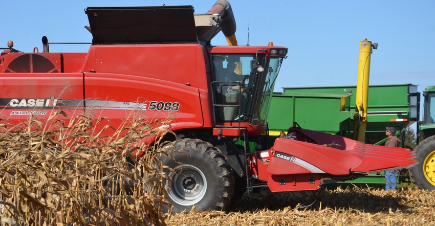 red Case IH combine harvesting corn