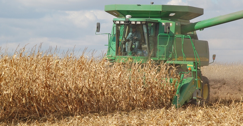 John Deere combine harvesting corn