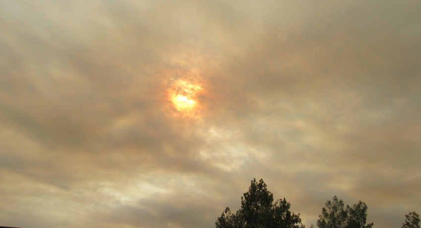 Sun shrouded in smoke