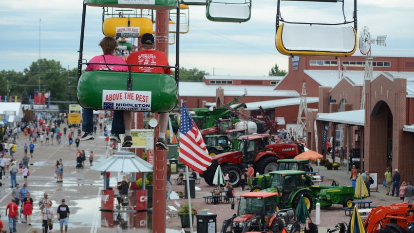 The view from the sky tram at Nebraska State Fair of crowds and tractors