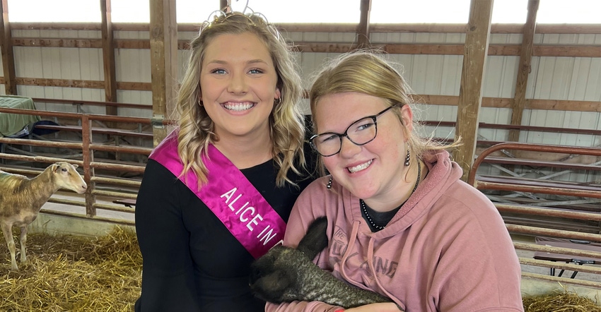 Taylor Schaefer with Kaila Cross, who's holding a sheep