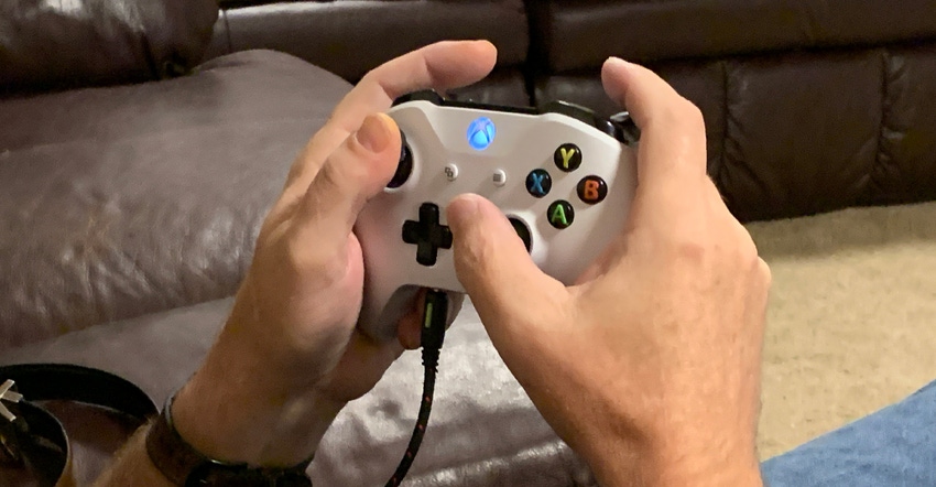 hands holding XBox controller