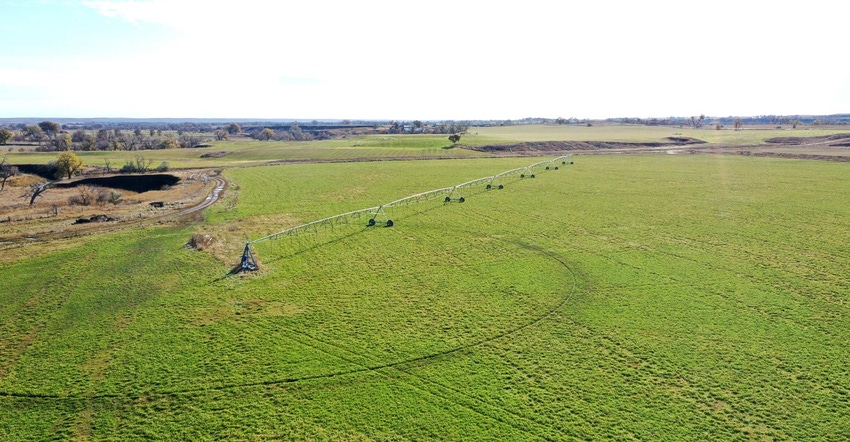 A pivot irrigation system operating on a field