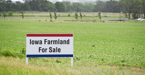 Iowa farmland for sale sign in field