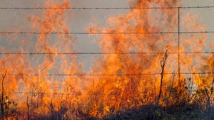 prairie fire behind barbed wire