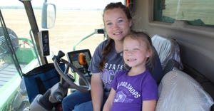 Micah Waggoner and her daughter Braylee Waggoner harvesting a wheat field near Isabel, Kan. 
