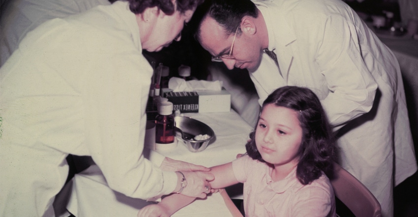 irl receiving polio vaccine in 1955