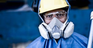 man wearing protective clothing and mask